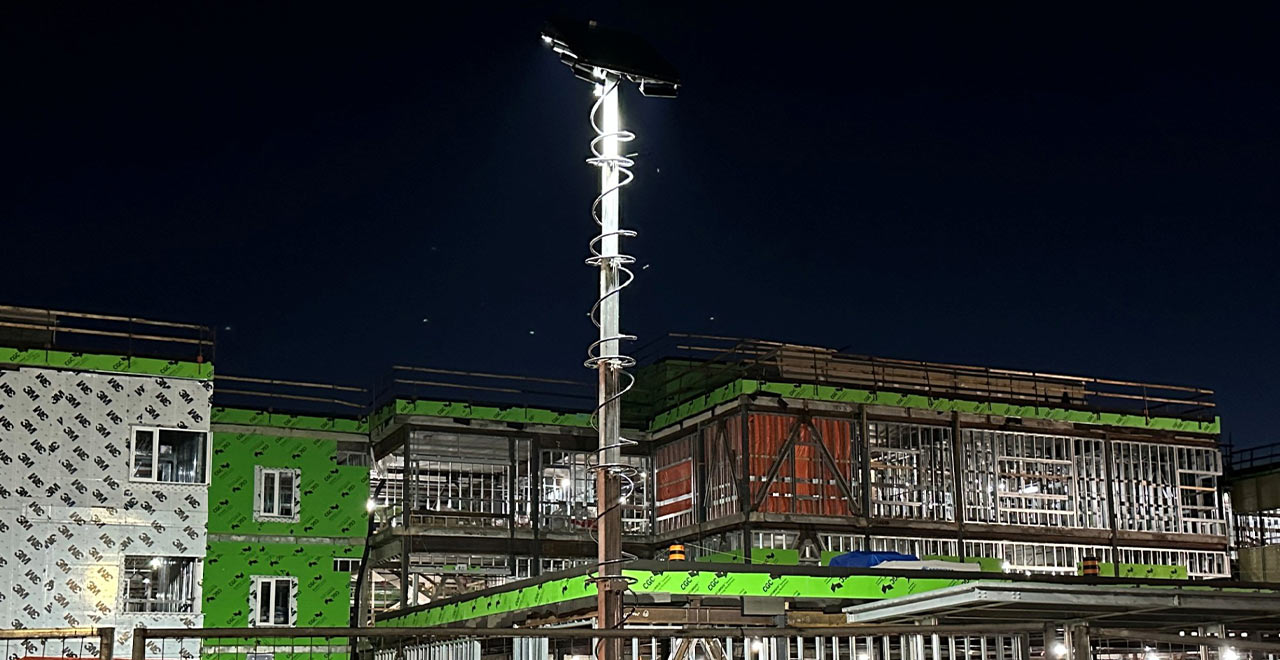 LED construction site lighting fixture at night for enhanced safety and visibility.